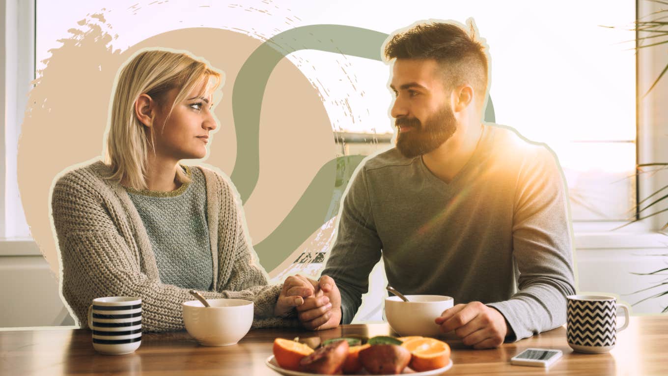 Couple having a heart to heart in the kitchen over coffee