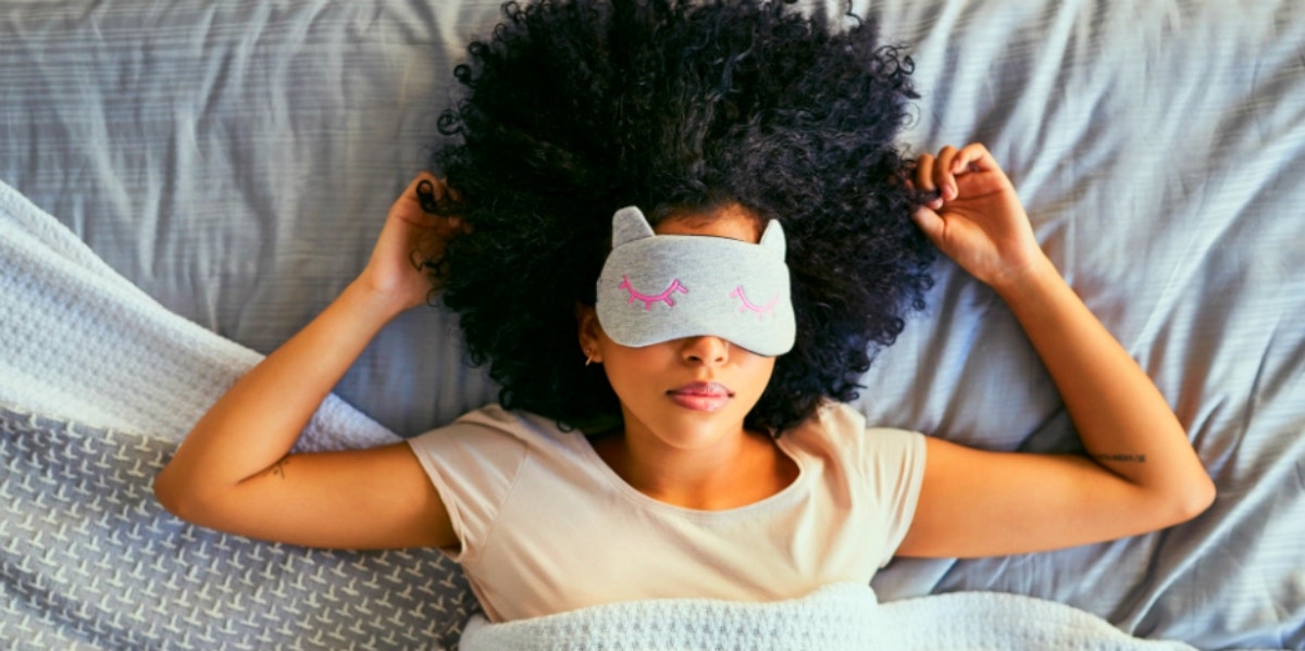 woman sleeping with mask