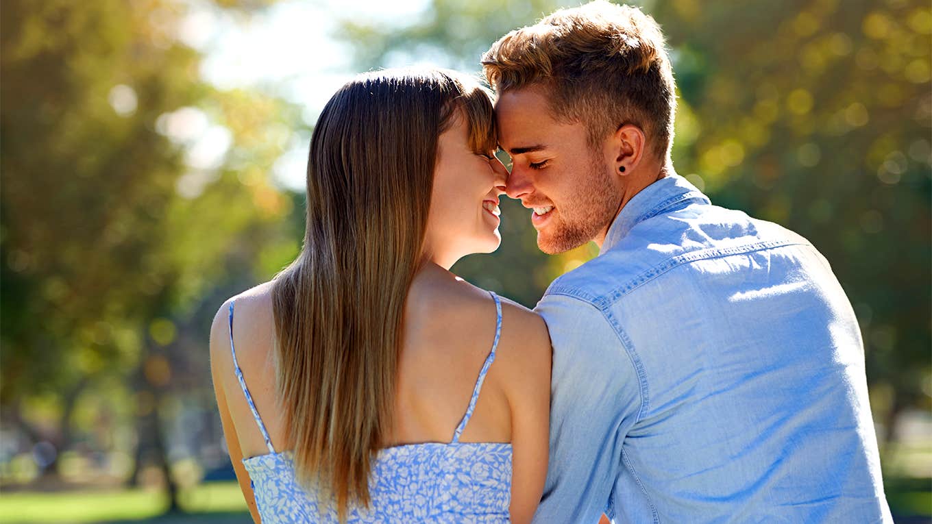 man and woman embracing face to face