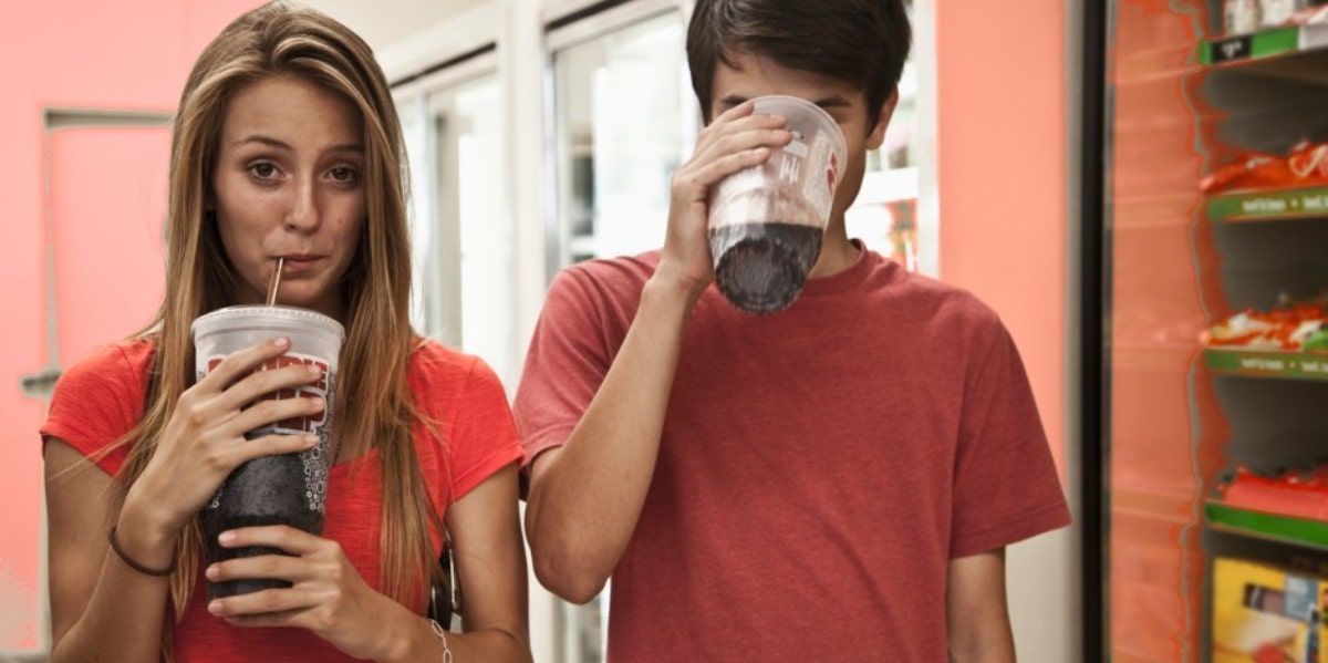 How To Take Your Power Back & Gain The Upper Hand In A Relationship couple drinking large sodas