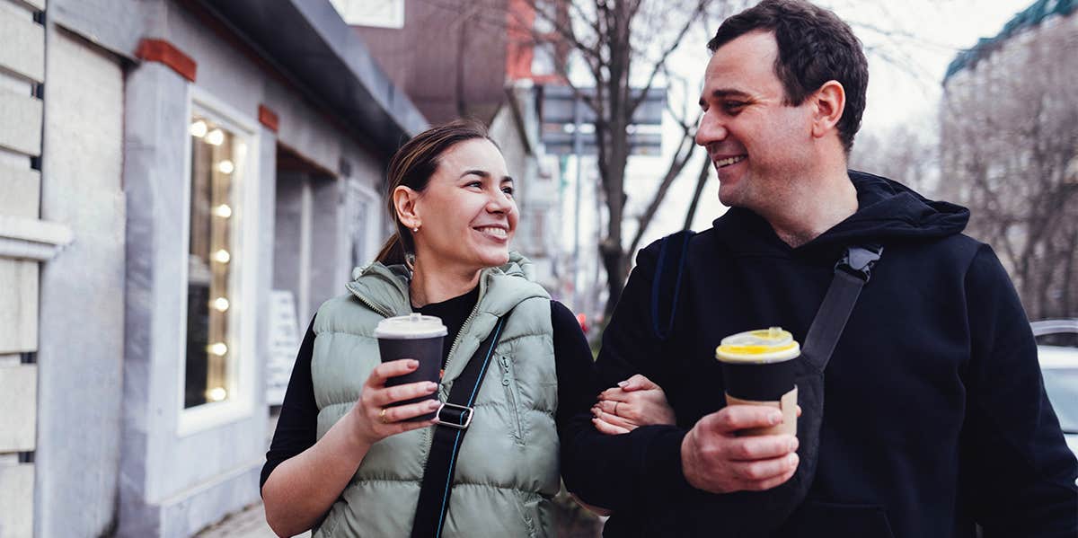 5 Taboo Topics All Married Couples Should Talk About couple walking together on sidewalk chatting