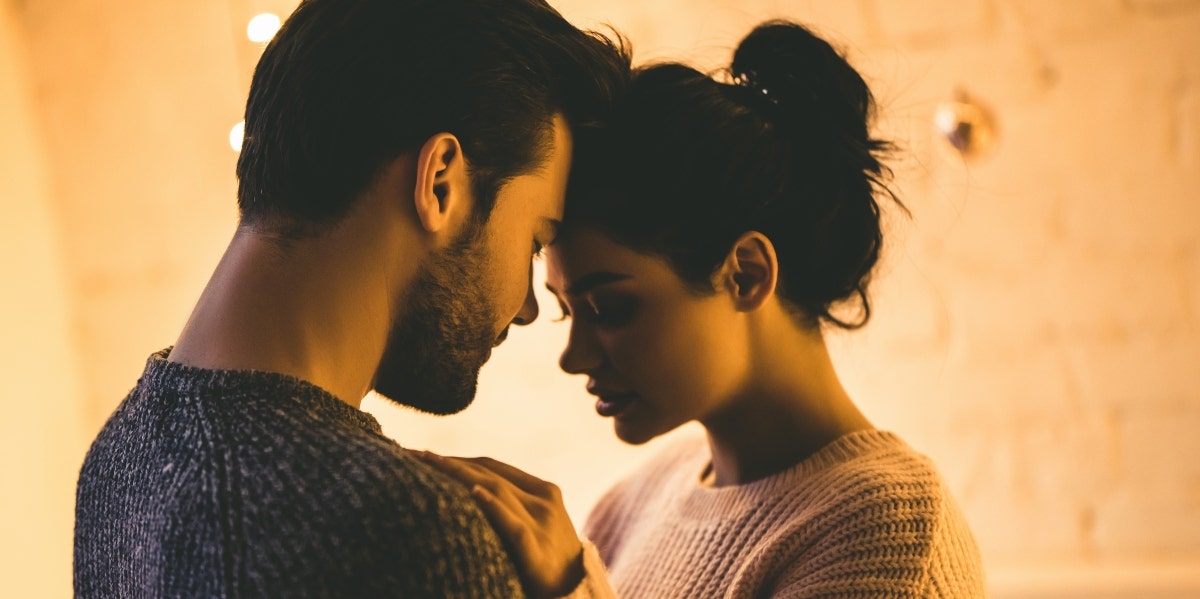 man and woman pressing foreheads