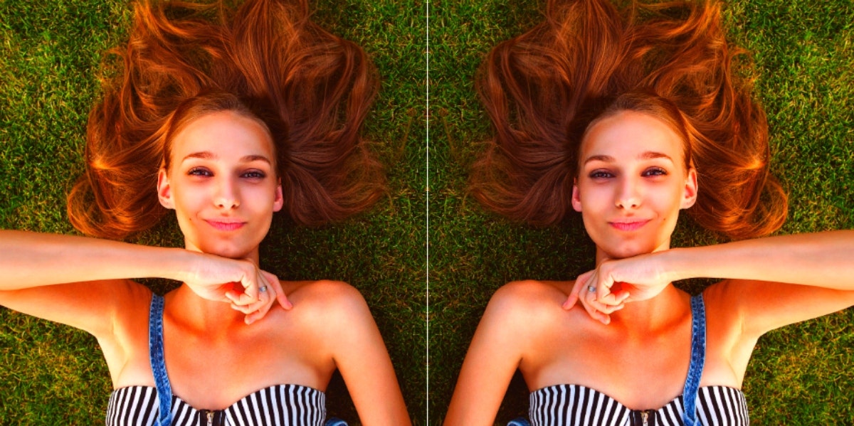 mirror image of woman lying on the grass