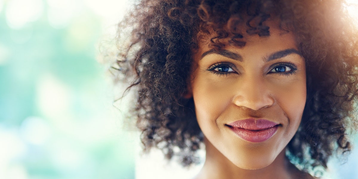 woman smiling in the sunshine