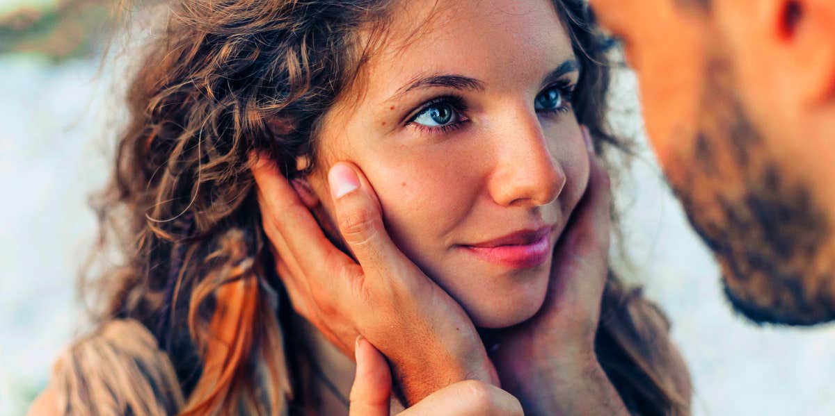 Ways To Love A Woman Who Has Been Cheated On man holding woman's face close