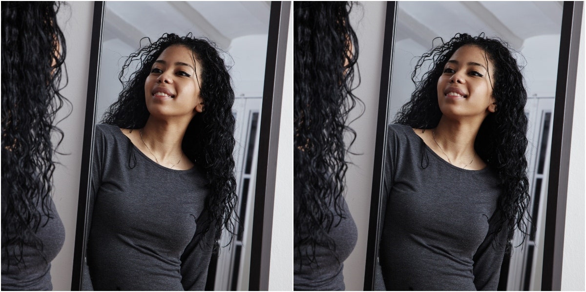 how to love your body woman looking in the mirror