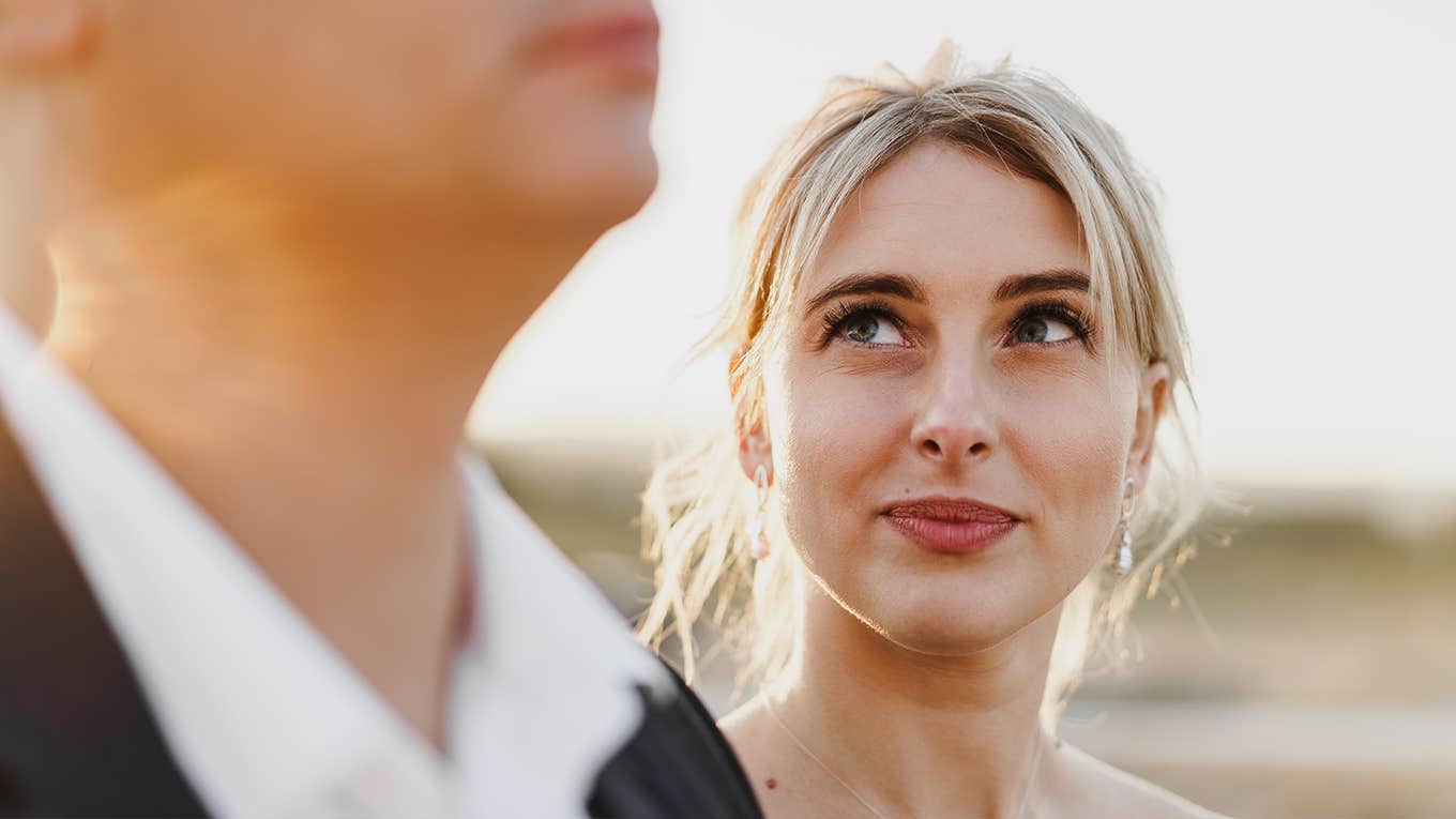 Portrait of a woman looking at a man in a sunset light