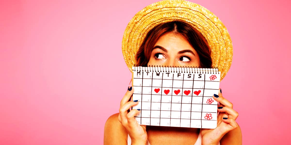woman with calendar showing when her period will come