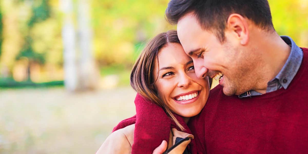 husband with arm around wife to make her feel secure