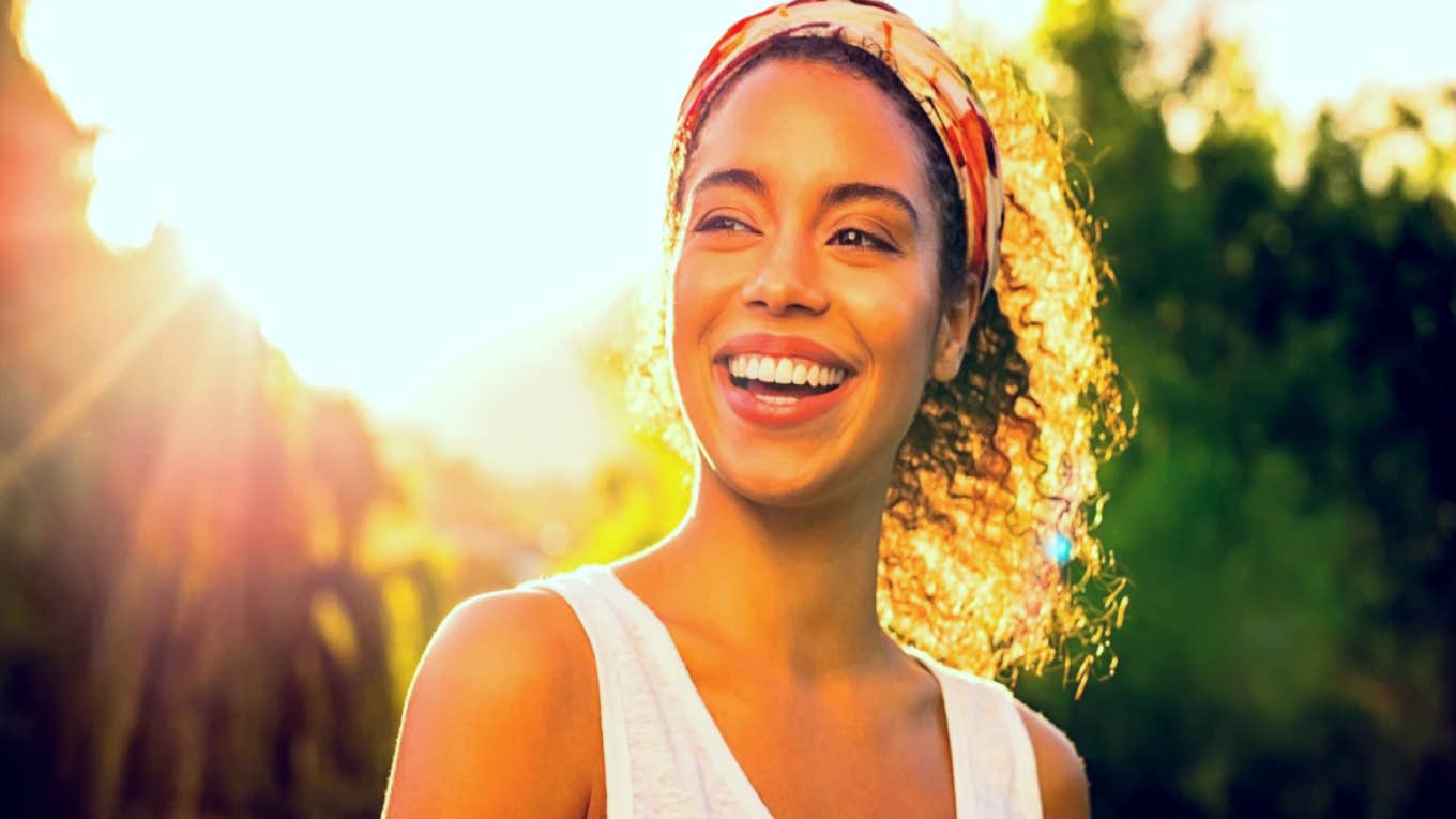 How To Manifest Happiness With 13 Small Daily Habits happy smiling woman