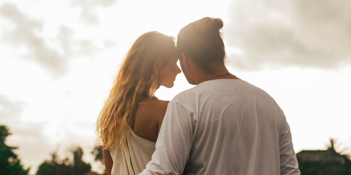 man and woman sitting together