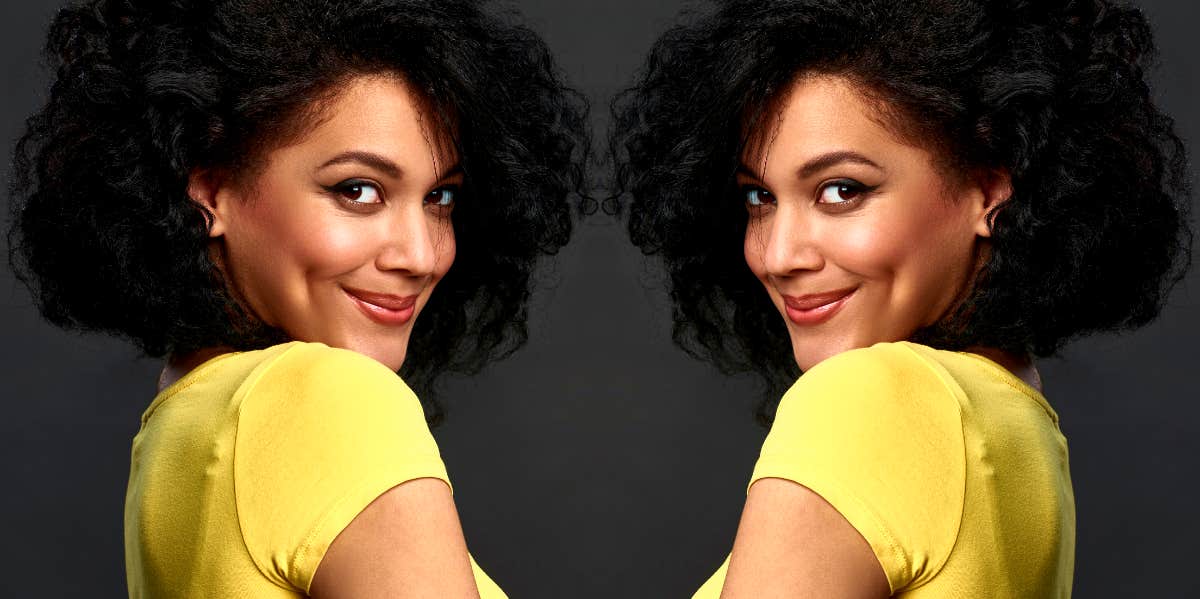 doubled image of woman looking coyly over her shoulder