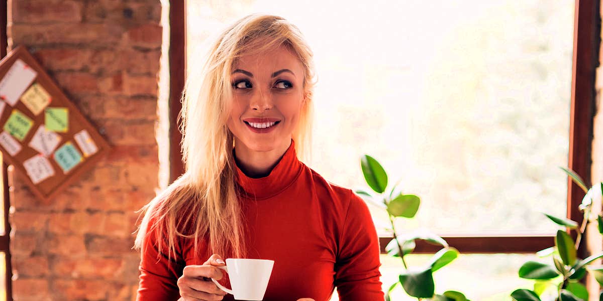 woman calmly smiling with tea