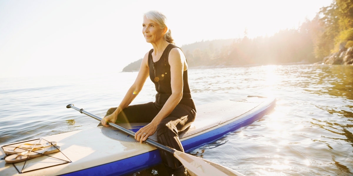 rightsizing your life as you age woman in kayak