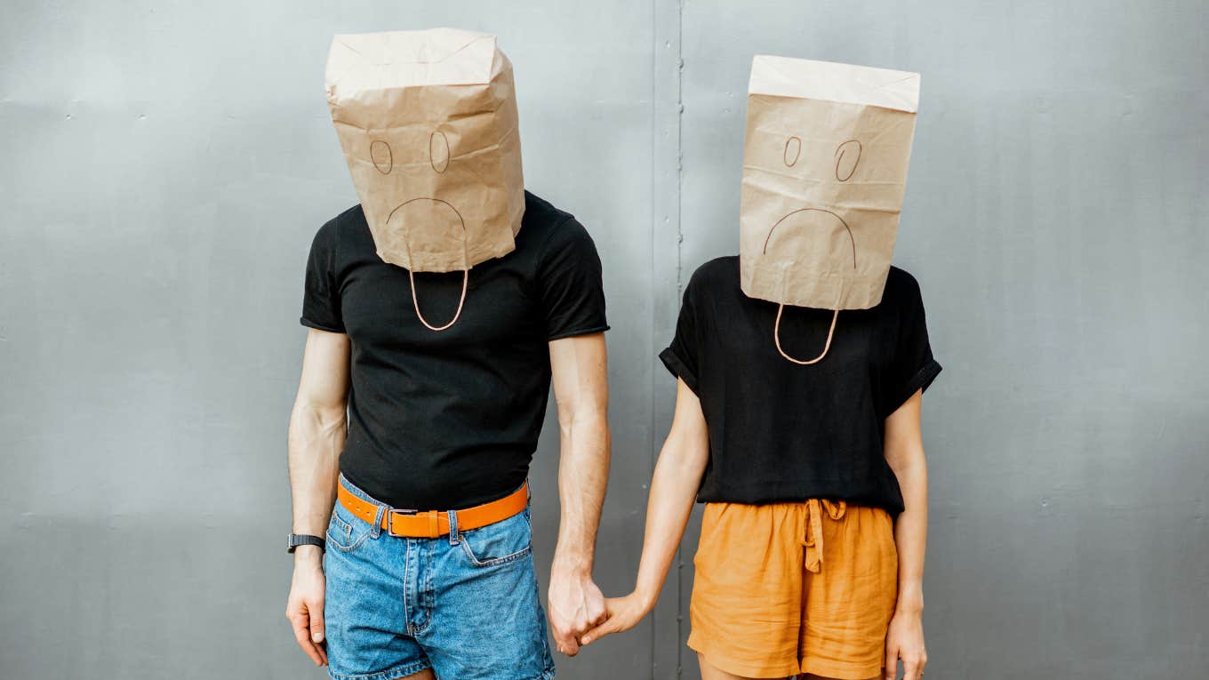 Couple with sage bags on their heads