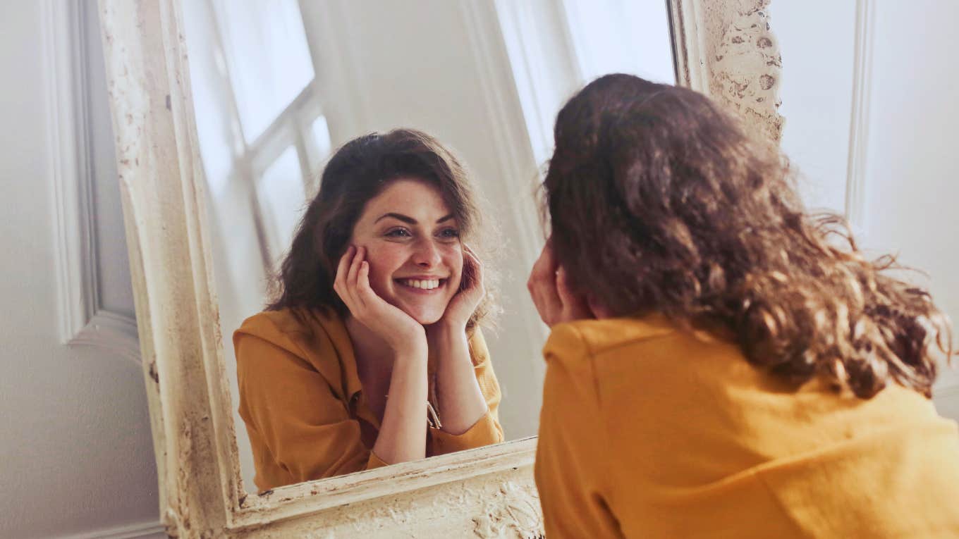 woman looking in a mirror