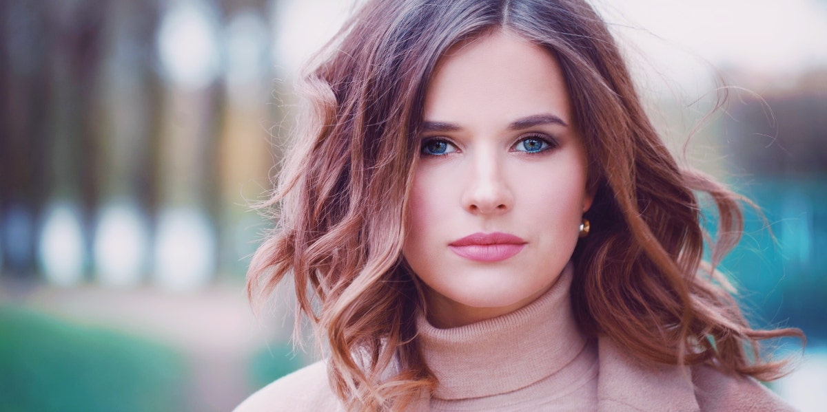 smiling woman in a turtleneck