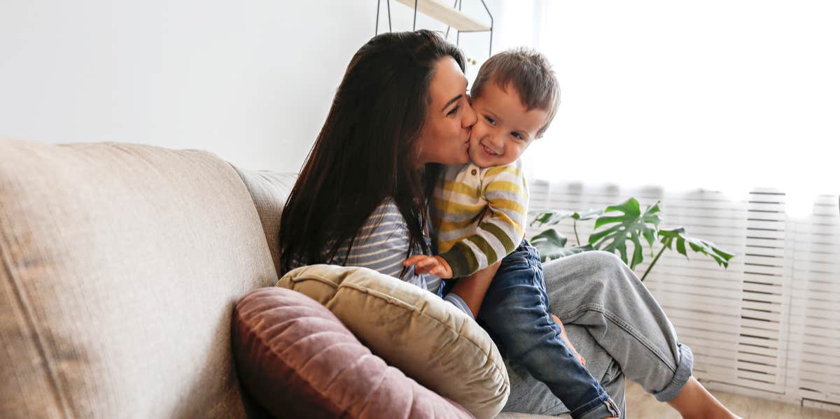 mother kissing son