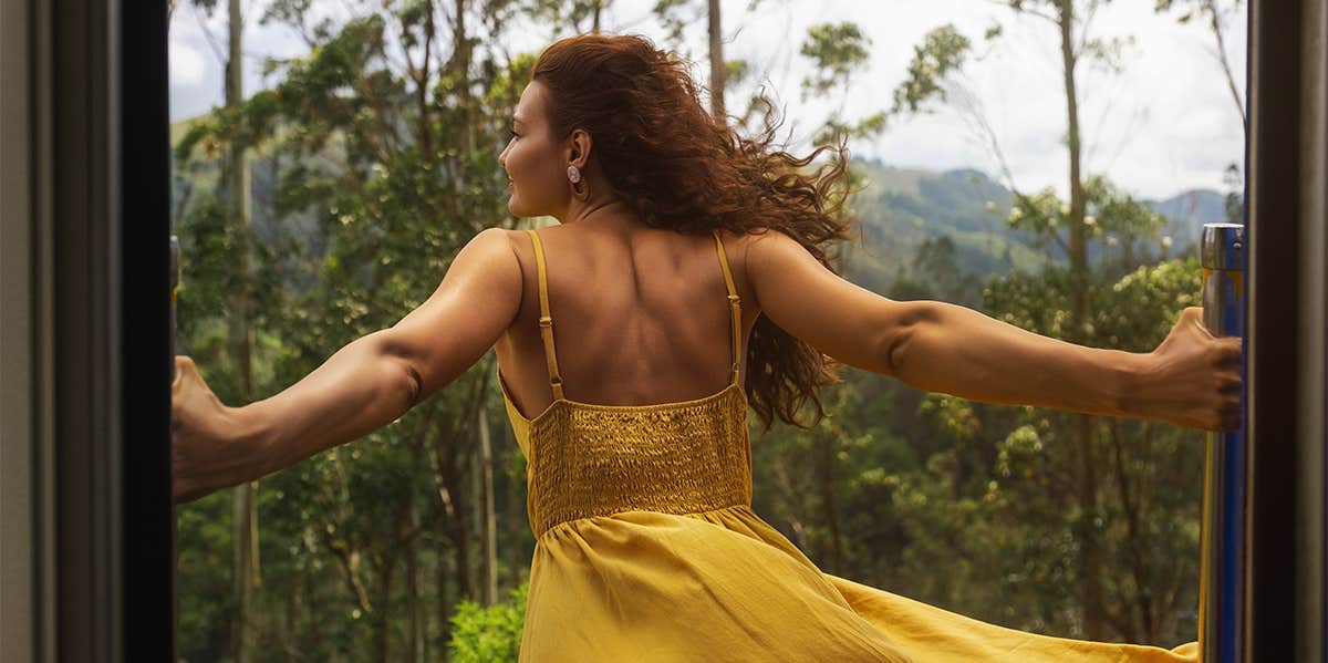 The One Change I Made To Become Fearless And Transform My Life woman standing out window