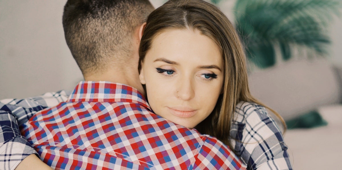how to support your partner's trauma troubled woman hugging man