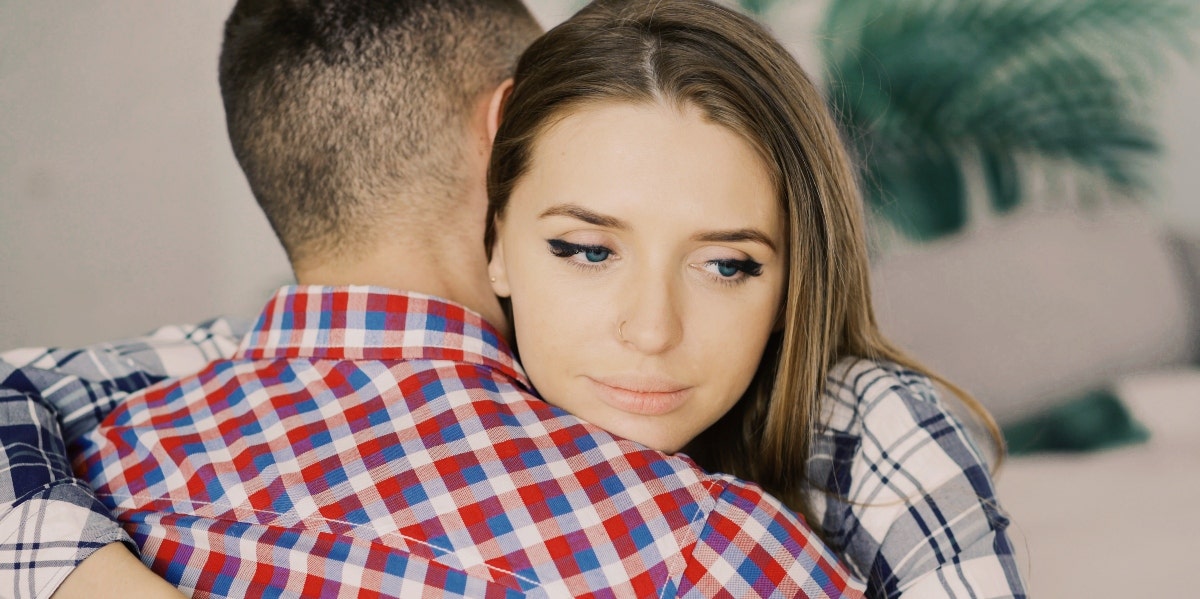 troubled woman hugging man