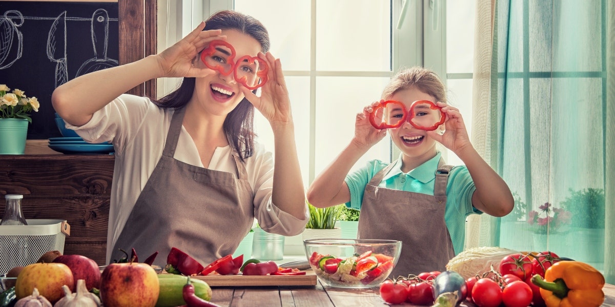 mom and daughter cooking together