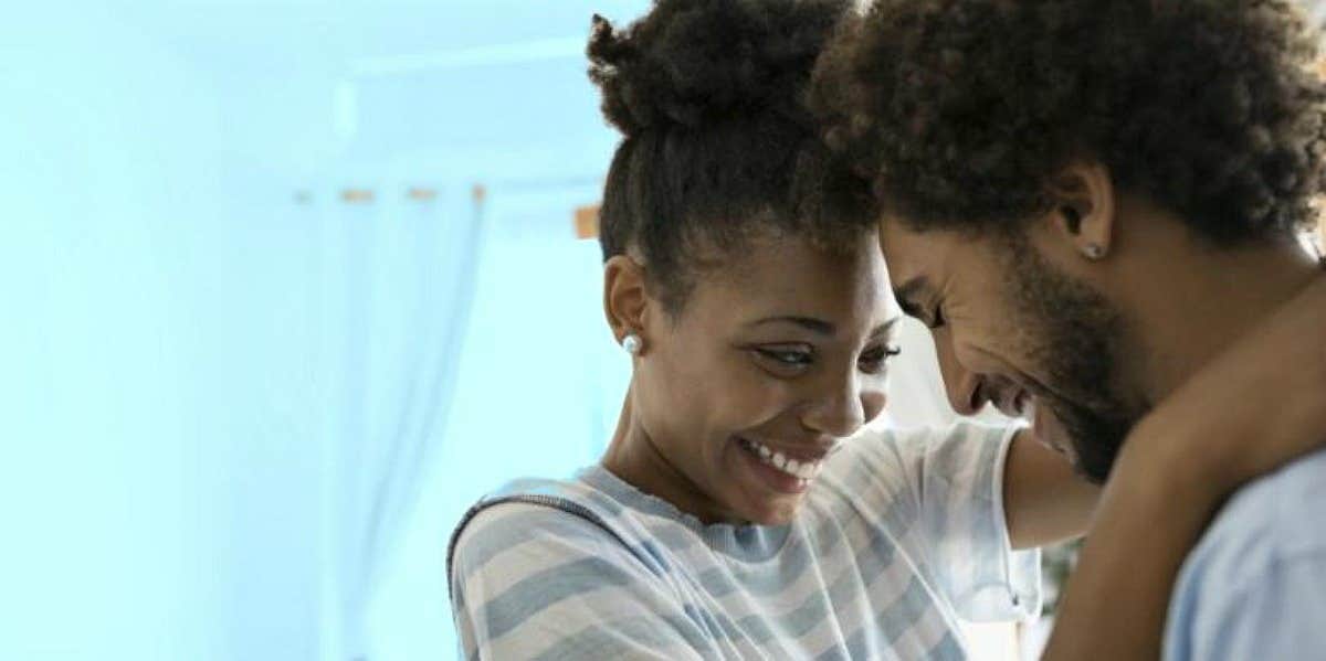 couple hugging after learning how to write a love letter