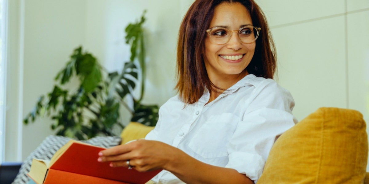 woman with book on her lap