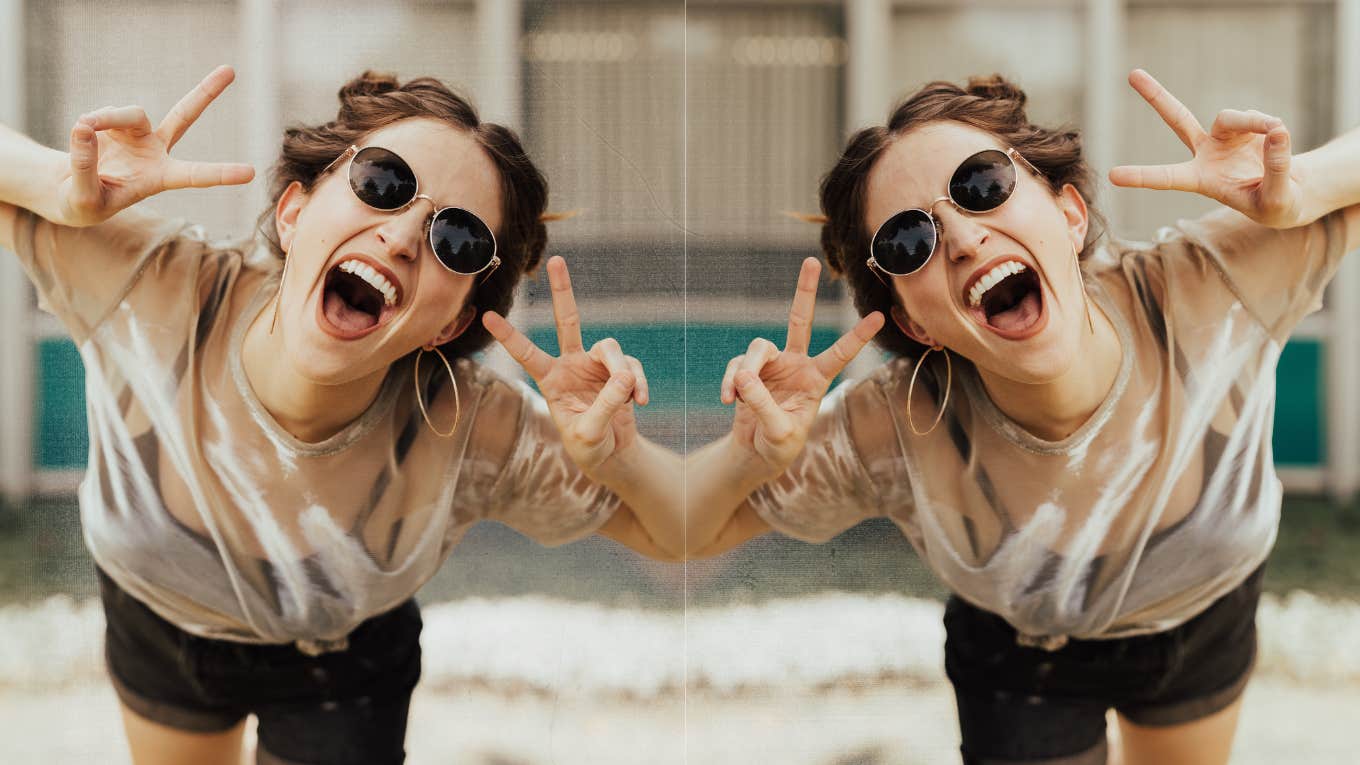 Young woman excited peace sign