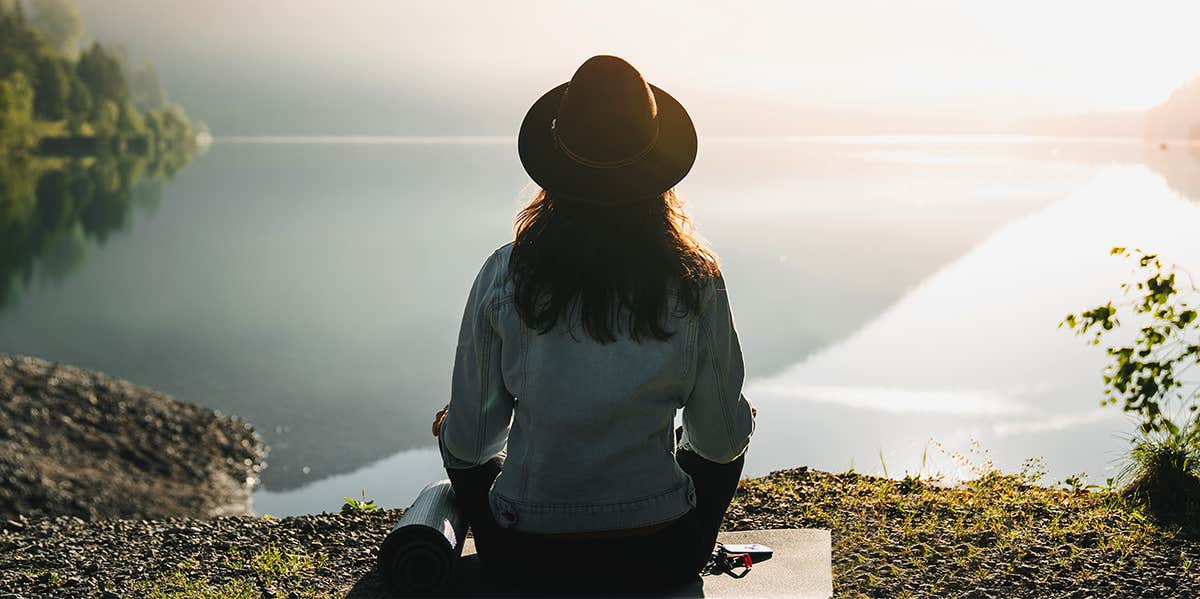 woman sitting enjoying view of ocean