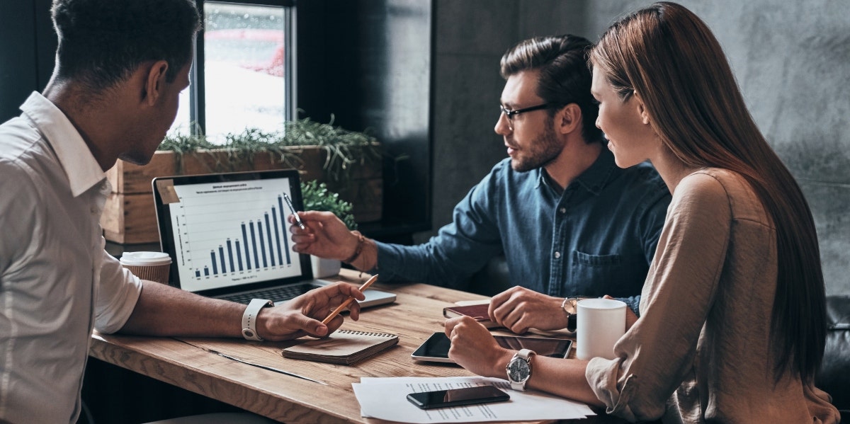 how your job betrays you two men and one woman looking at chart