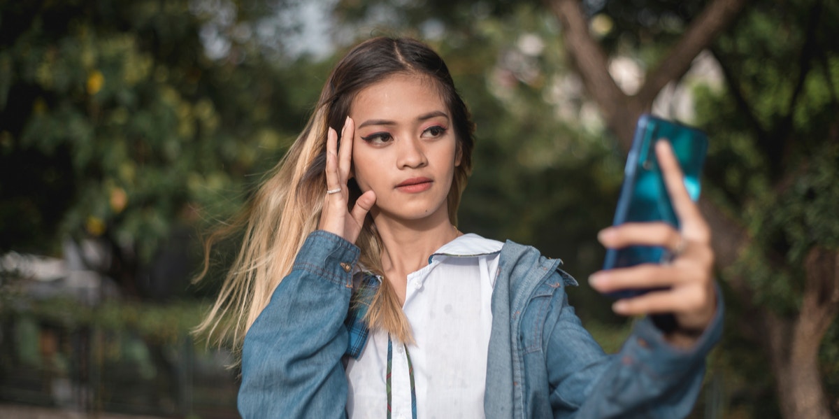 teen girl taking selfie