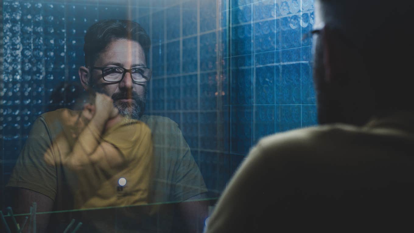 2 Huge Insecurities Alpha Males Hide, As Written By One Man confidently staring into mirror, inside tourtored by insecurity