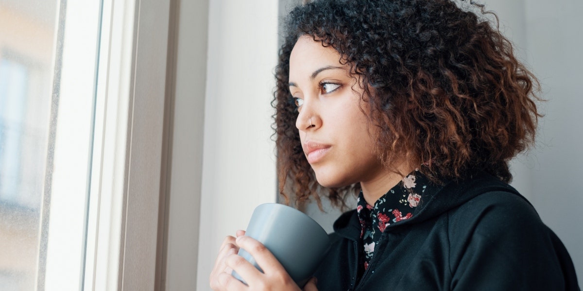 woman looking out the window