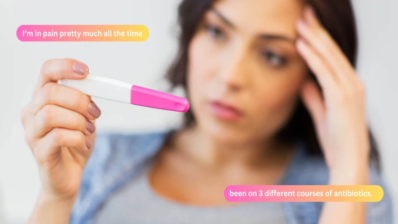 woman holding pregnancy test