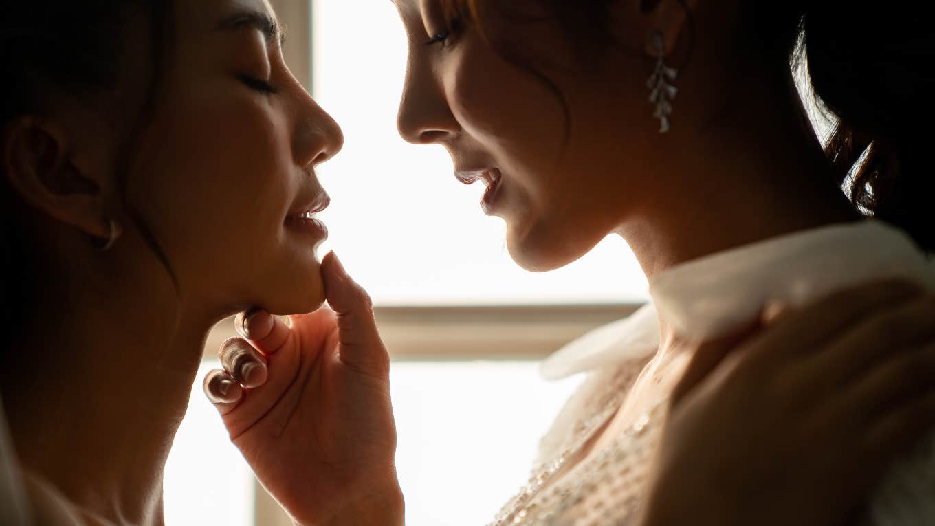 bride kissing her maid of honor