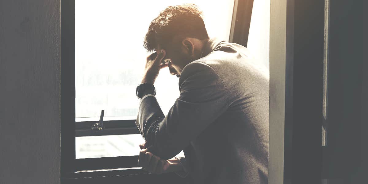 Man Realizes He's Been In A Loveless Marriage For Over 8 Years upset man looking out the window