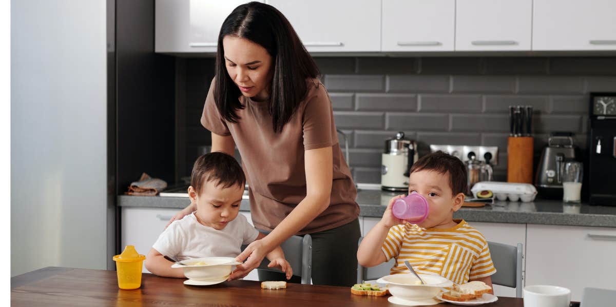 Mom with two kids in the kitchen 