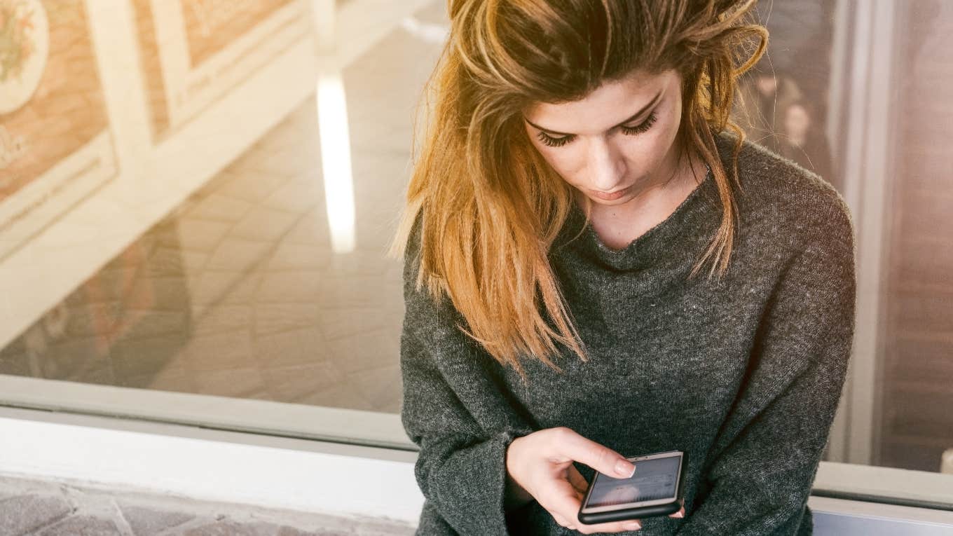 woman looking at phone