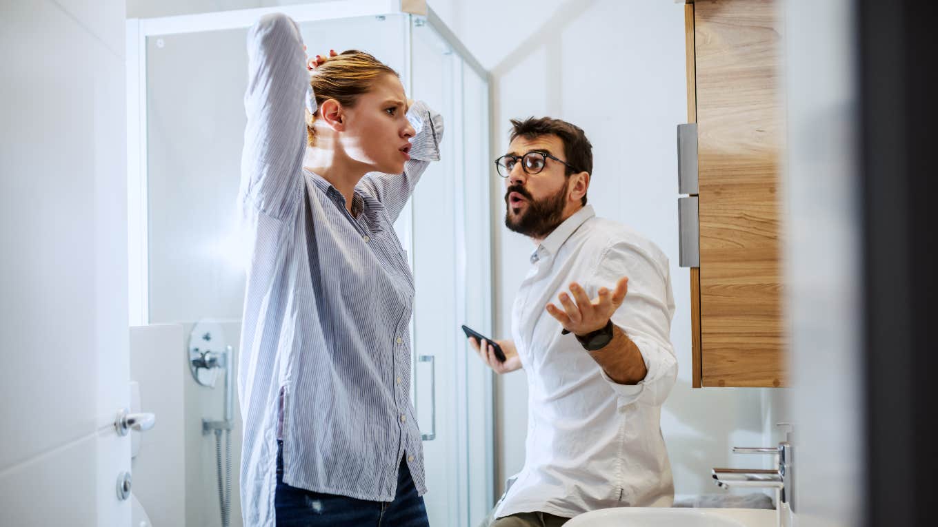 man and woman couple arguing in the bathroom