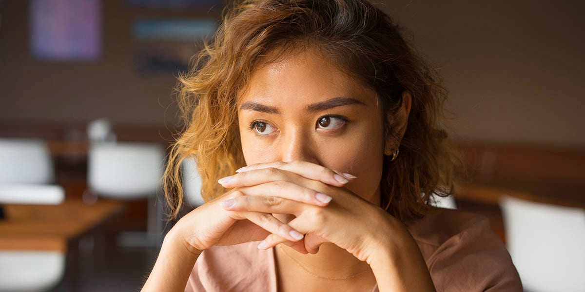 The Devastating Way I Found Out My Husband Was Gay woman looking worried