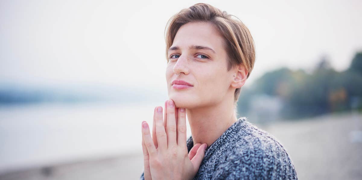 nonbinary person on beach