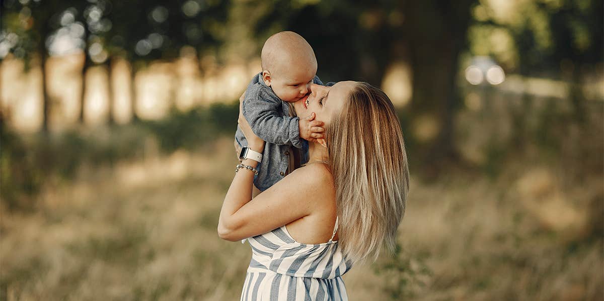 mother holding baby