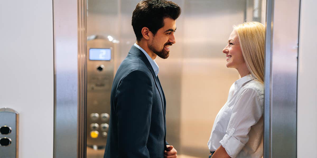 coworkers flirting near elevator
