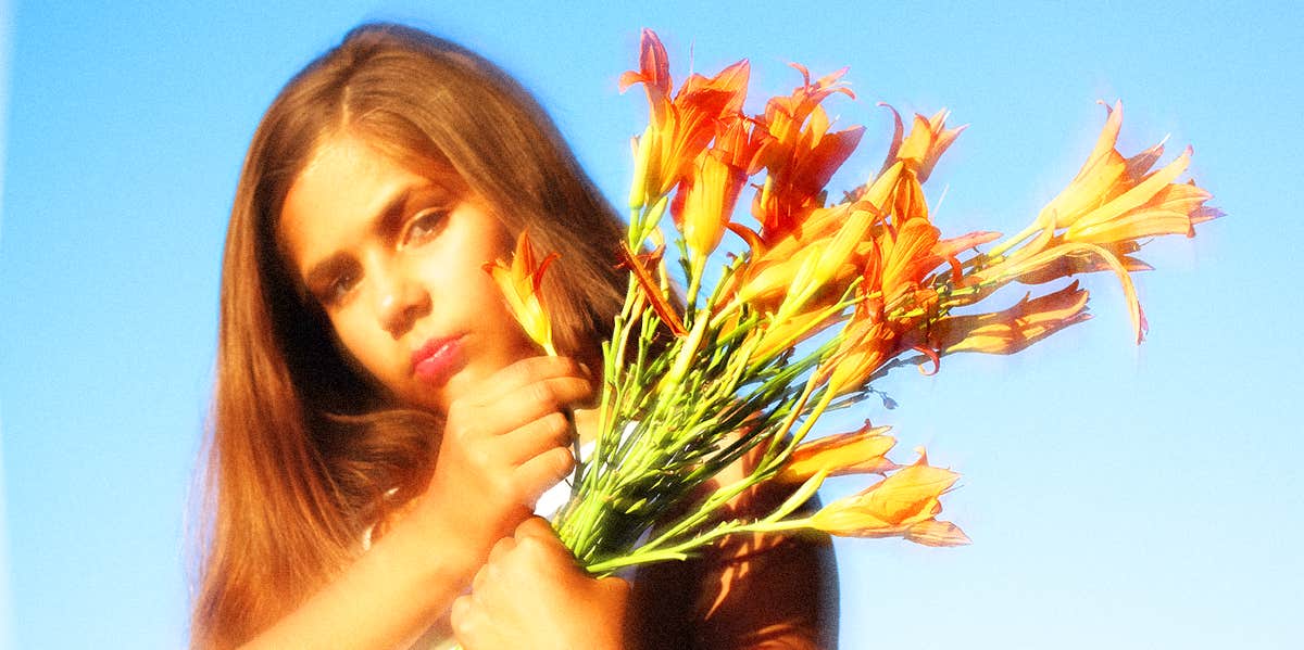 young girl holding flowers