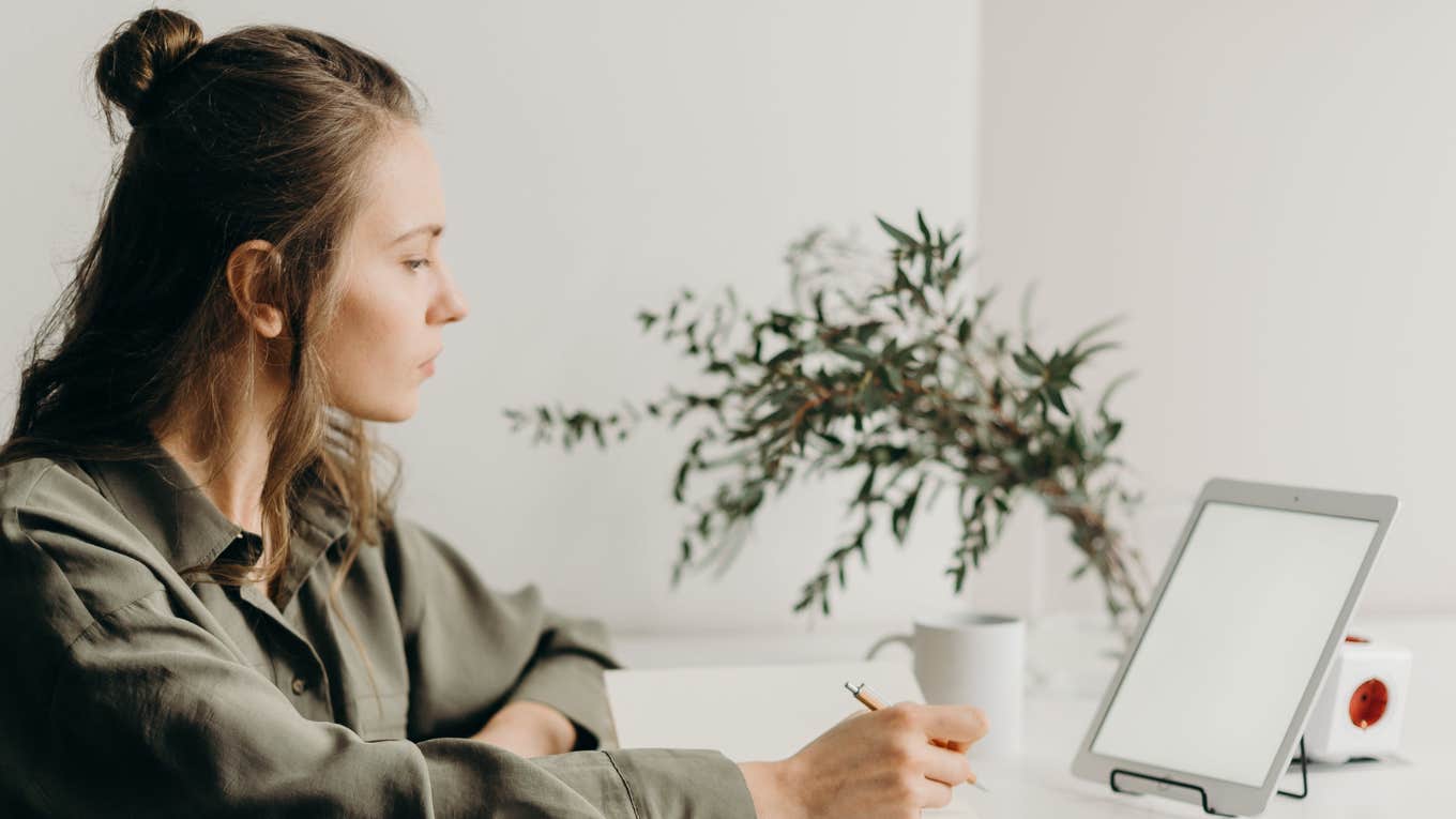 woman working on tablet 