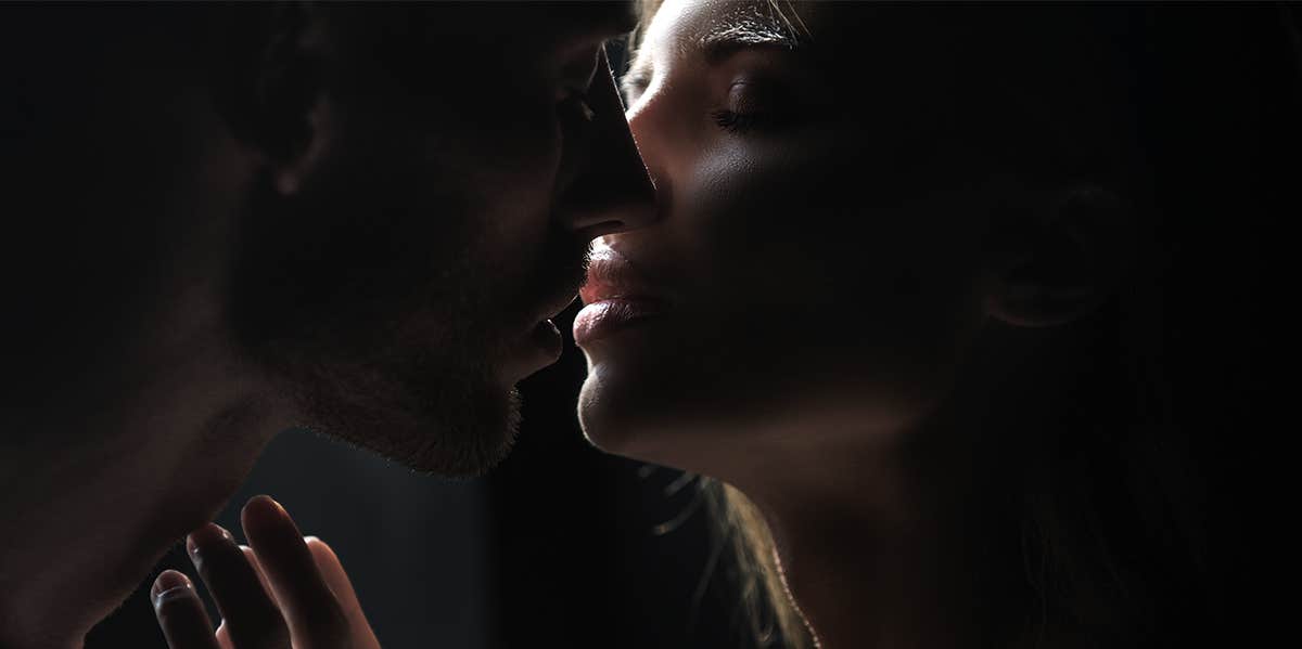 woman and man kissing