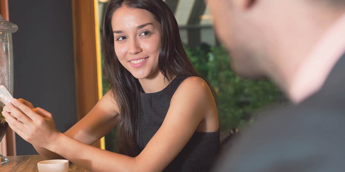 woman smiling at a man