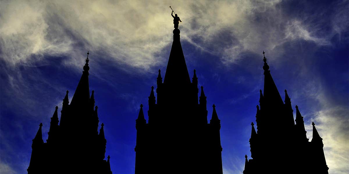 Mormon LDS Salt Lake City Temple Silhouette against Blue Cloudy Sky