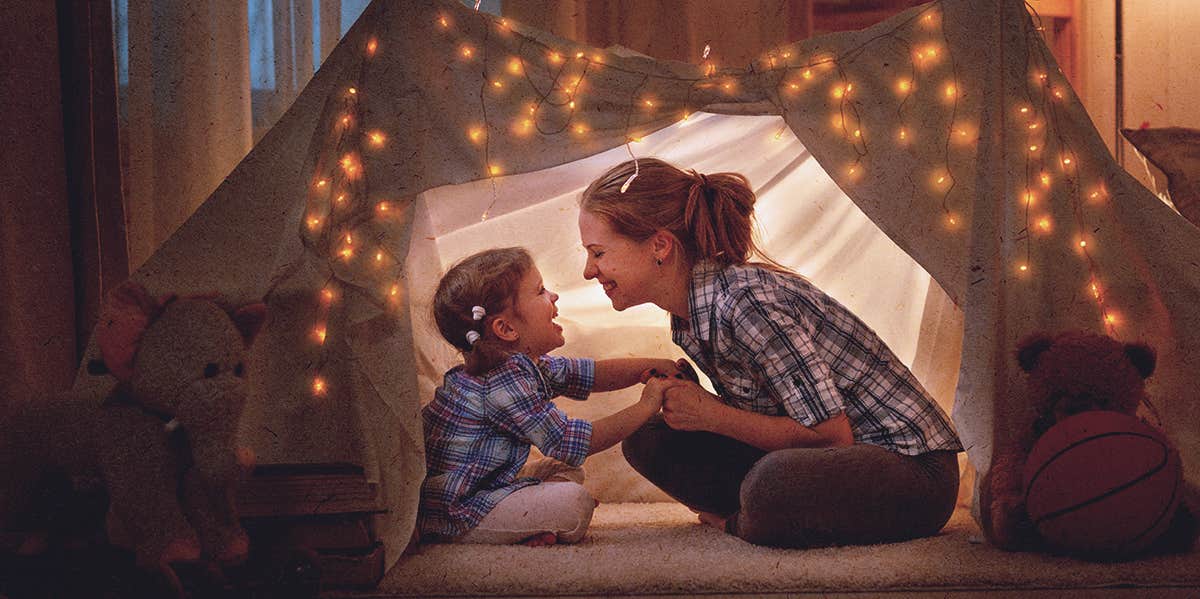 mom and child, in a tent at home